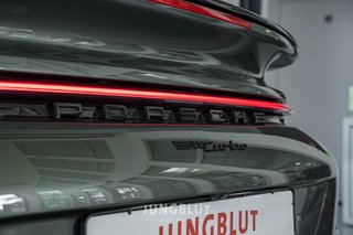 Porsche 992 Turbo Coupé + Glasdach + Carbon + Sport Design + Aventuringrün - foto 27