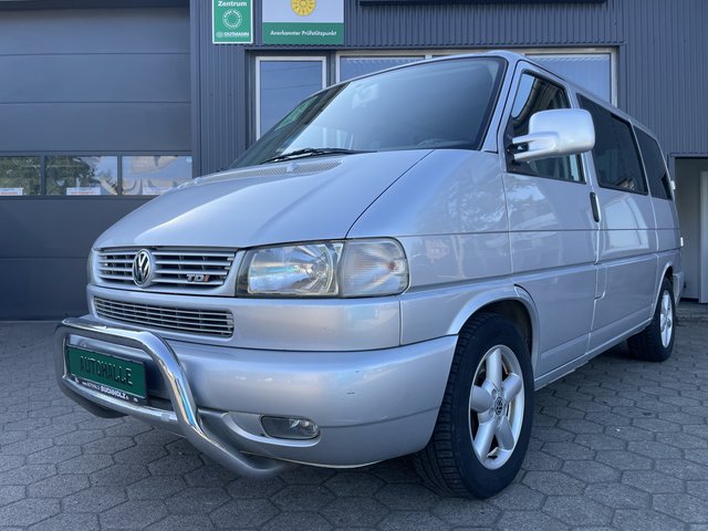 Volkswagen T4 Multivan ALLSTAR~Flügeltüren~ 2xKLIMAAUTOMATIK~BETT~TISCH~DREHBARE SHTZ~STANDHEIZUNG~TEMPO~AHK inkl. Gardinen~SCHECKHEFTGEPFLEGT~3.Hand~STH~XENON~KLAPPBARE HECKFLÜGEL - bilder 1